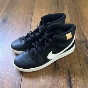 Women’s Nike high top sneaker.